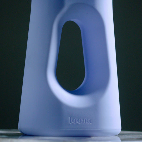 a blue portable urinal on a table